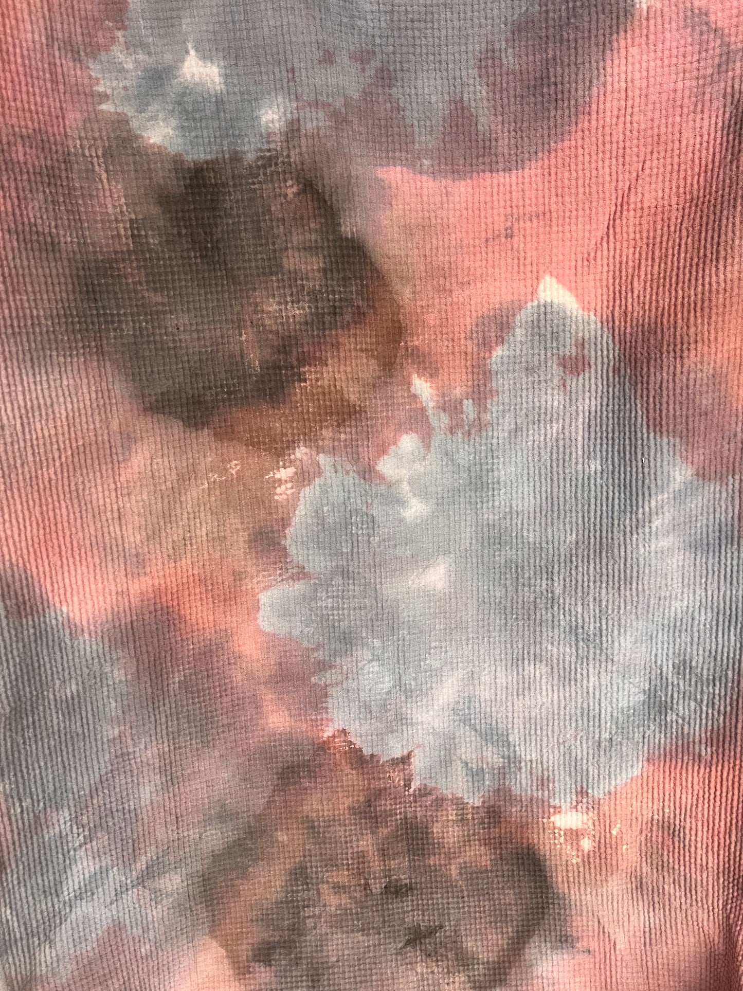 Close-up of a cotton throw blanket with a multicolored pattern