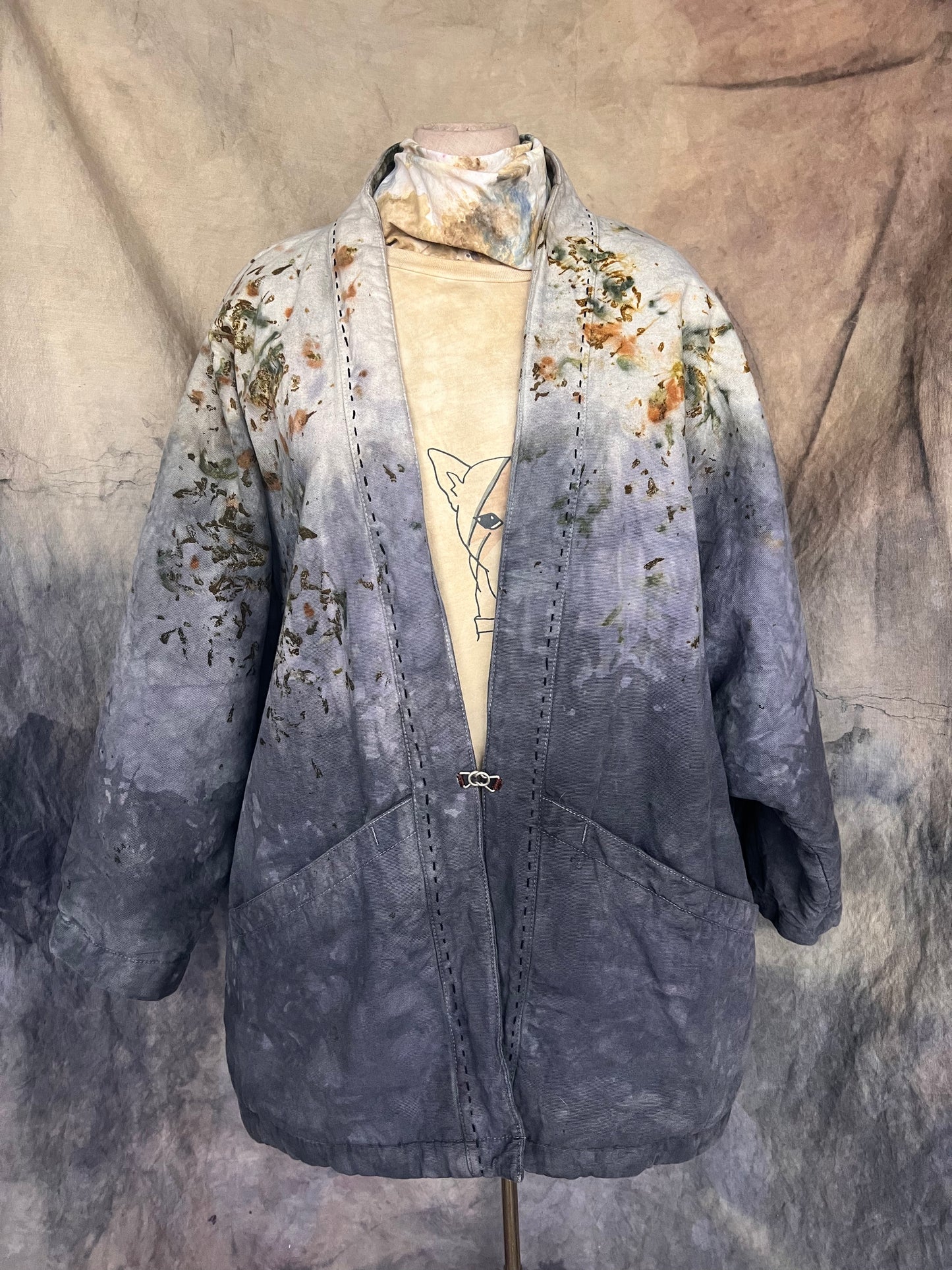 kimono style coat styled on mannequin with naturally dyed floral pattern.
