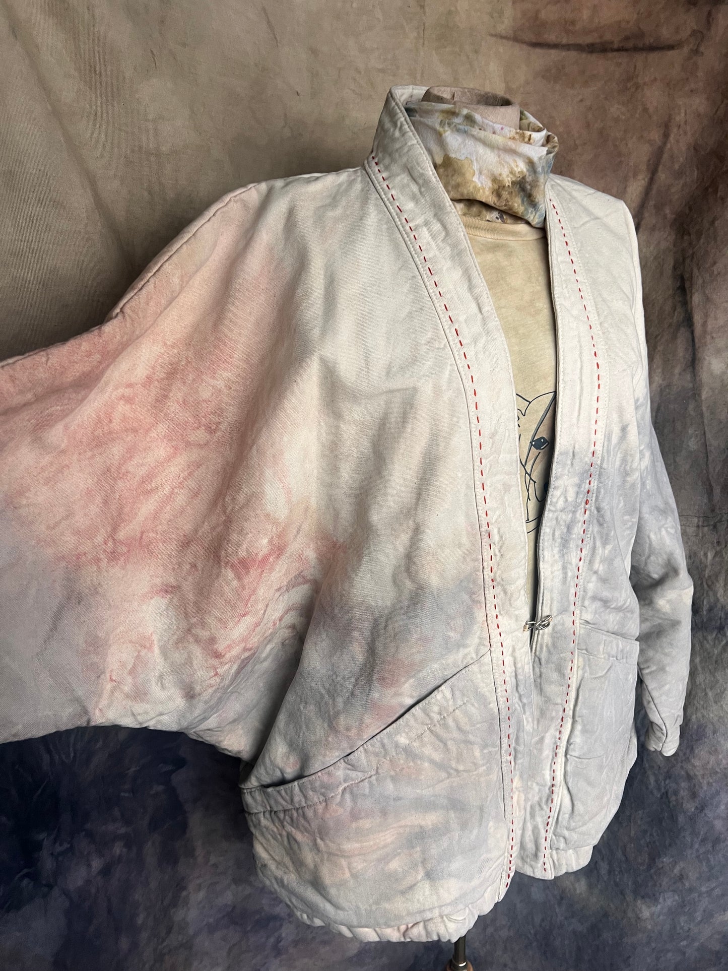 Side view of kimono style coat with pink and grey cloud pattern