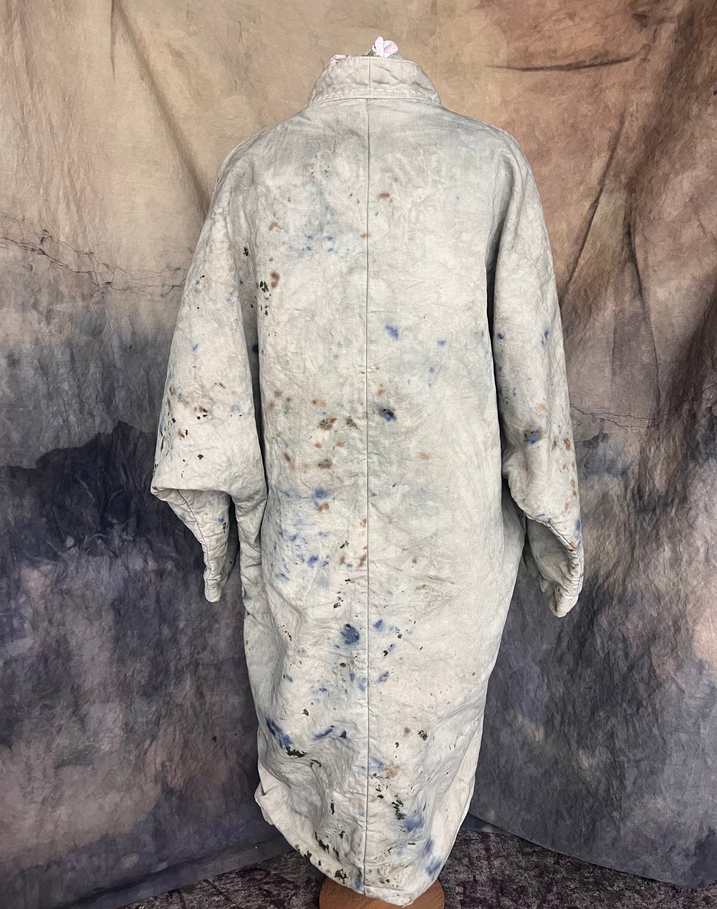 Long blanket style coat back view.