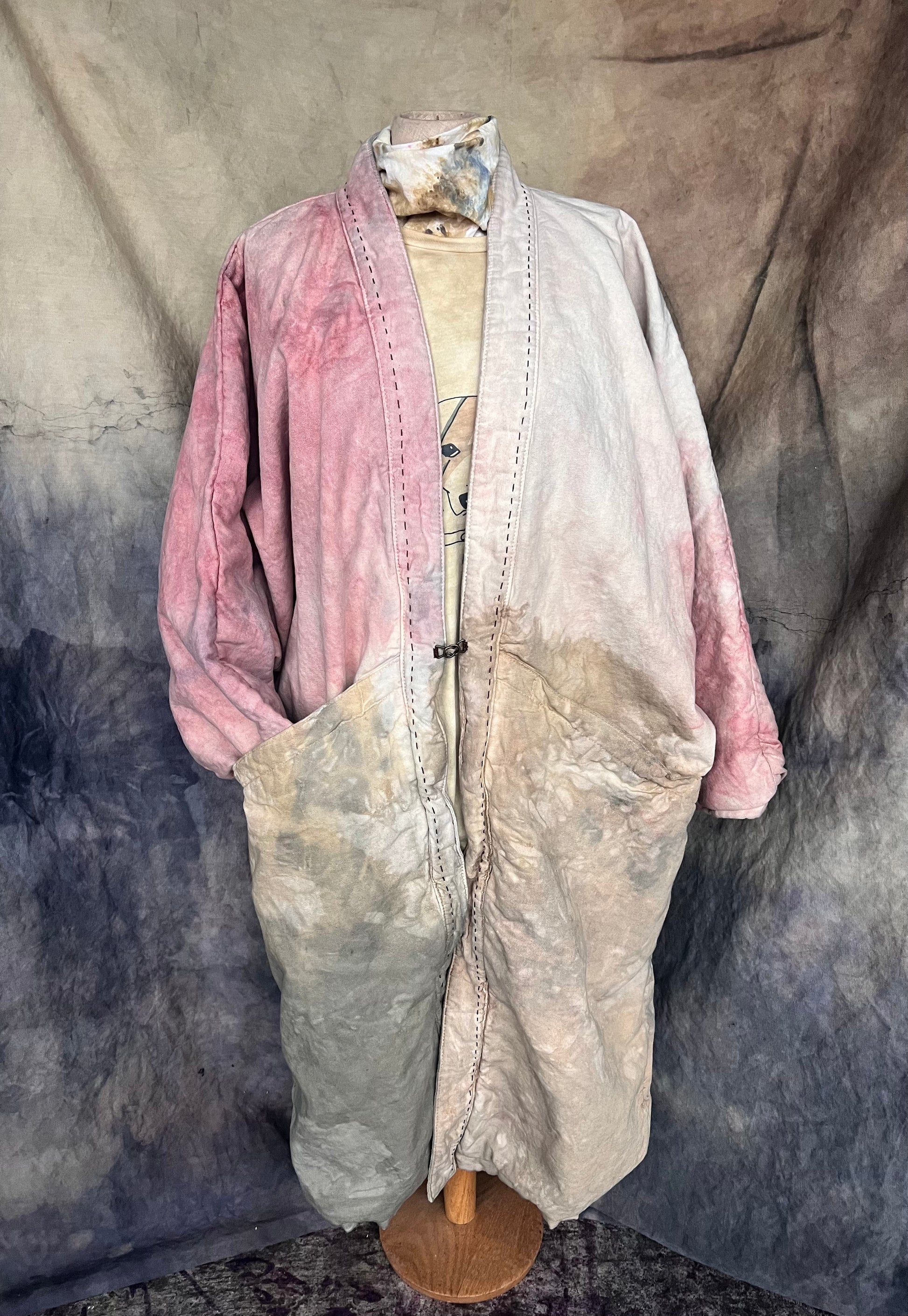 Long kimono coat with pink, tan, grey and yellow abstract pattern dyed with flowers. 