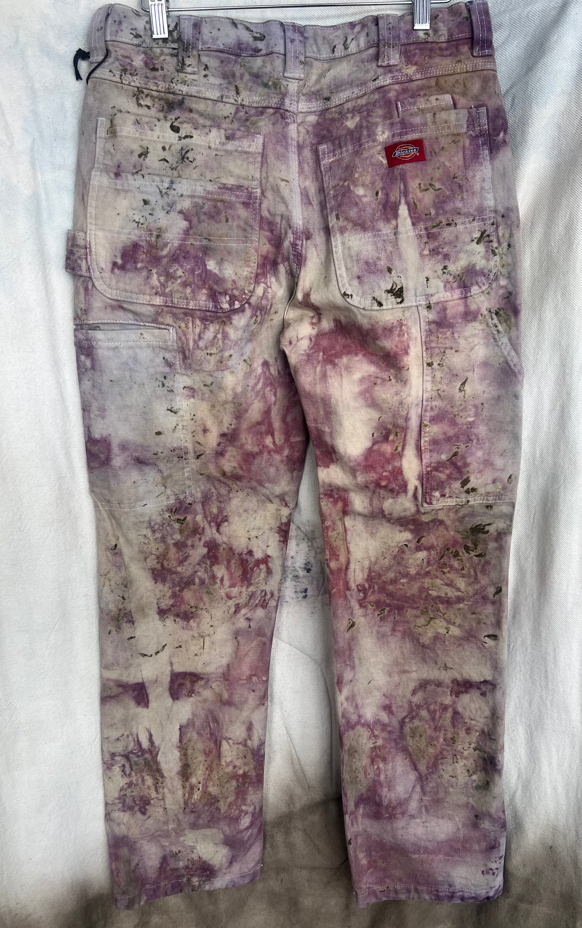back view of naturally dyed dickies painters pants in floral pattern