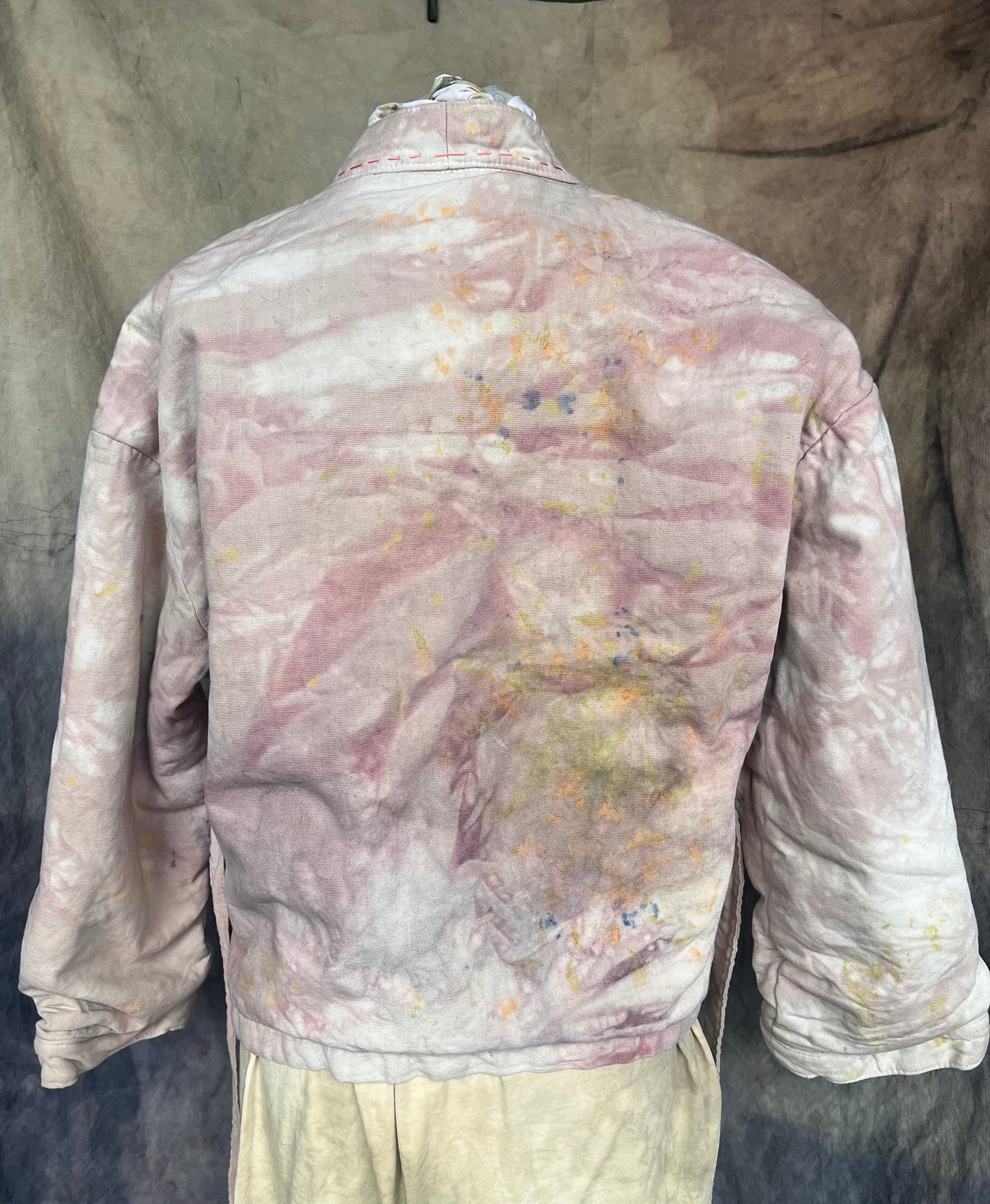 Back view of pink cloud short wrap coat.