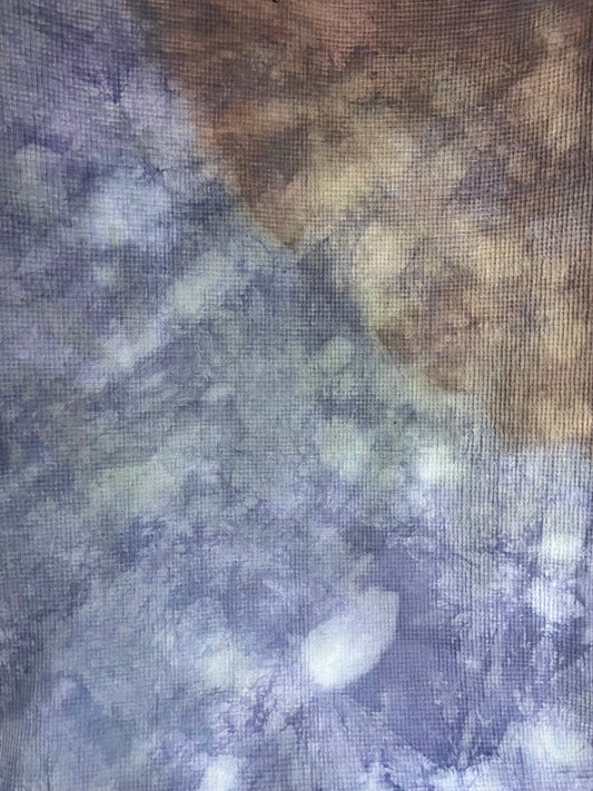 Natural dye with an abstract floral pattern cotton throw blanket.