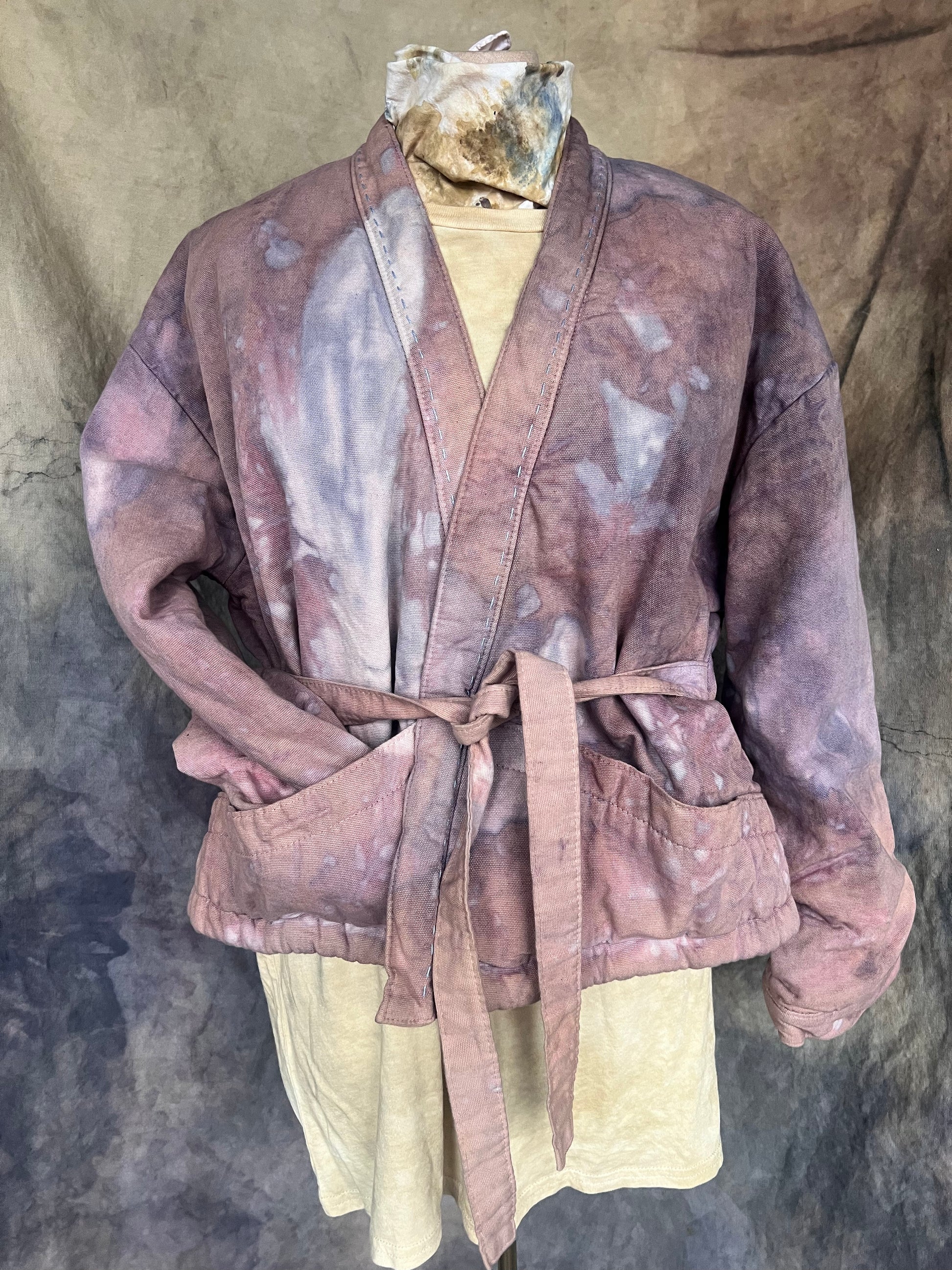 short wrap coat dyed in an abstract pattern of mauve and blue indigo. 